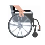 A man's hand pushing a wheelchair after a TPD claim