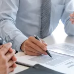 Paperwork and pen exploring Difference between TPD and income protection insurance