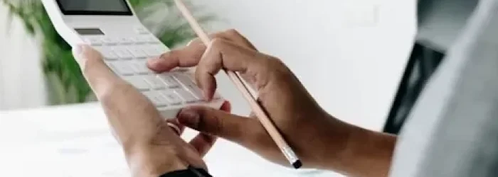 A no win no fee lawyer calculating legal fees