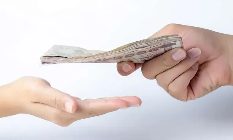 Handing over money after a successful TPD insurance payout