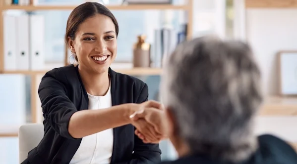 A picture of a client shaking hands with a TPD lawyer after hiring them for a permanent disability superannuation claim